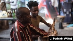 Oduor Nyagweno, left, and Daniel Onyango, play the nyatiti.