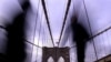 People make their way across the Brooklyn Bridge during the evening rush on day two of a crippling system-wide mass transit strike Wednesday, Dec. 21, 2005 in New York. (AP Photo/Jason DeCrow)