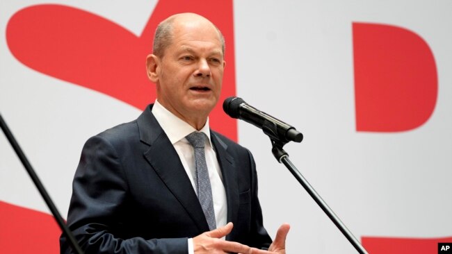 FILE - Olaf Scholz speaks during a press conference at Social Democratic Party headquarters in Berlin, Germany, Sept. 27, 2021.