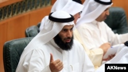 FILE - Former Kuwaiti Minister of Justice, Islamic endowments and Islamic Affairs Nayef al-Ajmi speaks at a session of Kuwait's National Assembly. Ajmi resigned in the wake of accusations by a senior U.S. official that he was enabling terrorism.