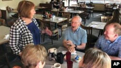 The Democratic-endorsed candidate for Minnesota governor, Rep. Erin Murphy, greets voters at the New Louisiana Cafe in St. Paul, Minn., Aug. 13, 2018, as she makes a final get-out-the-vote push ahead of the Tuesday primary. 