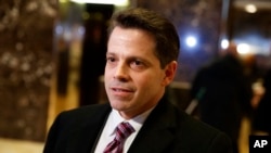 FILE - Anthony Scaramucci, then senior adviser to President-elect Donald Trump, talks to reporters in the lobby of Trump Tower in New York, Jan. 13, 2017. CNN has not immediately commented on what led it to retract a story about a supposed investigation into a pre-inaugural meeting between Scaramucci and the head of a Russian investment fund.
