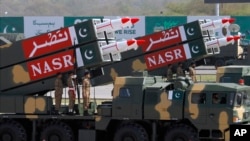 FILE - Pakistani-made NASR missiles are on display during a military parade to mark Pakistan's Republic Day, in Islamabad, Pakistan, March 23, 2017.
