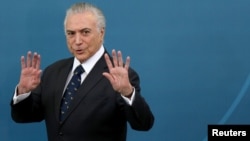 Brazil's President Michel Temer gestures during a ceremony at the Planalto Palace in Brasilia, Brazil, March 7, 2017.