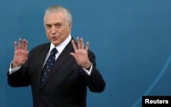 Brazil's President Michel Temer gestures during a ceremony at the Planalto Palace in Brasilia, Brazil, March 7, 2017.
