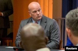 FILE - Then-Chief of Staff to the Attorney General Matthew Whitaker attends a roundtable discussion at the Justice Department in Washington, Aug. 29, 2018.