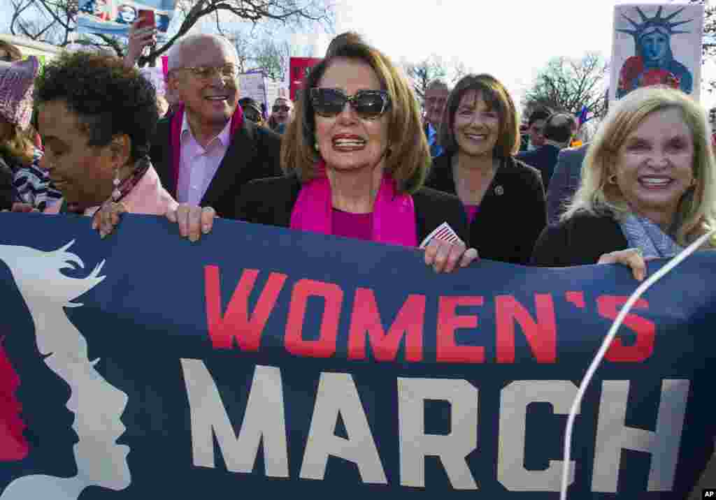 House Minority Leader Nancy Pelosi, D-Calif., center, Rep. Susan Davis, D-Calif, background center right, and Rep. Carolyn Maloney, D-N.Y., right, participate in the Women&#39;s March walk to the White House in Washington, Jan. 20, 2018.&nbsp;