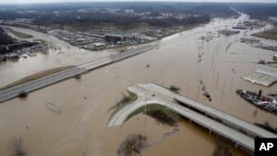 In this aerial photo, flood water covers Interstate 44, in Valley Park, Mo., Dec 30, 2015. A rare winter flood threatened nearly two dozen federal levees in Missouri and Illinois on Wednesday as rivers rose, prompting evacuations in several places. 