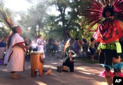 Aztec dancers participate in a four directions morning ceremony, July 17, 2017, at the University of New Mexico in Albuquerque as part of school's annual course on Curanderismo indigenous healing methods from the American Southwest and Latin America.