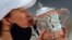Poland's Iga Swiatek kisses the trophy after winning the French Open tennis tournament against Sofia Kenin of the US in two sets 6-4, 6-1, at the Roland Garros stadium in Paris, France, Oct. 10, 2020. 