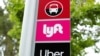 FILE PHOTO: A sign marks a rendezvous location for Lyft and Uber users at San Diego State University in San Diego, California, U.S., May 13, 2020. REUTERS/Mike Blake/File Photo