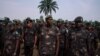 Soldiers of the Armed Forces of the DRC (FARDC) wait in line during the national day of entrance examinations for military specialities at the ‘General Major Chicko Tshitambwe’ camp in Mambango on the outskirts of Beni, North Kivu, in the east of the Demo