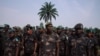 Soldiers of the Armed Forces of the DRC (FARDC) wait in line during the national day of entrance examinations for military specialities at the ‘General Major Chicko Tshitambwe’ camp in Mambango on the outskirts of Beni, North Kivu, in the east of the Demo