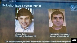 Pictures of Russian-born scientists Andre Geim (R) and Konstantin Novoselov are shown on a television screen at the Swedish academy of sciences in Stockholm following the announcement that they won the Nobel Prize in physics, 5 Oct 2010.