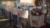 Voters cast their ballots at privacy booths during early voting at the Brooklyn Museum in New York, Oct. 27, 2020.