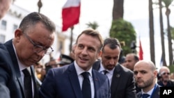 French President Emmanuel Macron meets with Moroccans after delivering a speech in the Parliament, in the capital Rabat, Oct. 29, 2024.