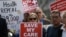 FILE - Supporters of the Affordable Care Act, who are also opponents of Colorado's GOP-led plan to undo Colorado's state-run insurance exchange gather for a rally organized by the national Save My Care Bus Tour, on the state Capitol steps in Denver, Feb. 