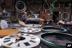 Clockmaker Jim Gongoleski works on restoring the Eastman monument clock in Medfield, Massachusetts, Oct. 30, 2024.