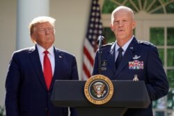 U.S. President Donald Trump listens as U.S. Air Force Gen. John Raymond, commander of SPACECOM, speaks during an an event to officially launch the United States Space Command in the Rose Garden of the White House in Washington, Aug. 29, 2019.