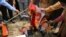 Bharatiya Janata Party activists burn photographs of Chinese President Xi Jinping during a protest in Jammu, India, Wednesday, July.1, 2020. Indian TikTok users awoke Tuesday to a notice from the popular short-video app saying their data would be…