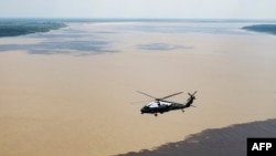 Marine One, with U.S. President Joe Biden aboard, flies over the Amazon River during an aerial tour during his visit to Manaus, Brazil, on Nov. 17, 2024, before heading to Rio de Janeiro for the G20 Summit.