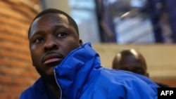 Theo Luhaka, 28, who suffered serious injuries when assaulted with a police baton in a Paris suburb during an identity check seven years ago, arrives for the first day of the trial of three police officers at the Assize court in Bobigny, near Paris, on Jan. 9, 2024.