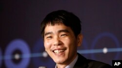 South Korean professional Go player Lee Sedol smiles as he speaks during a press conference after winning the fourth match against Google's artificial intelligence program, AlphaGo, in Seoul, South Korea, March 13, 2016. 