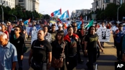 FILE - Supporters of Malaysian opposition leader Anwar Ibrahim march toward the Palace of Justice at Putrajaya, Malaysia, Feb. 10, 2015.