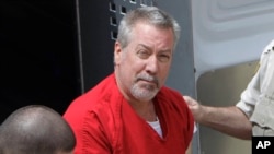 FILE - Former Bolingbrook, Illinois, police officer Drew Peterson arrives for court in Joliet, Illinois, May 8, 2009. On May 31, 2016, jurors found Peterson guilty of trying to hire someone to kill the prosecutor who helped convict him in his third wife's death.