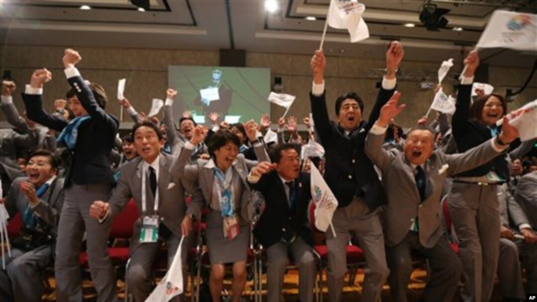 Tokyo 2020 delegation celebrates as city is awarded Summer Games during 125th IOC session, Buenos Aires, Sept. 7, 2013.