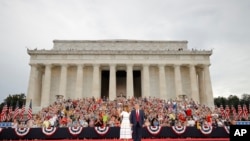 President Donald Trump and first lady Melania Trump arrive at an Independence Day celebration in front of the Lincoln Memorial, July 4, 2019, in Washington.