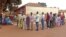 People queue during elections to cast their ballot's at a polling station in Bissau, Guinea-Bissau, May 18, 2014. 
