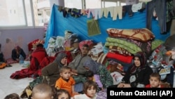 Syrian refugees shelter in a two-story wedding ceremony hall in the Turkish town of Reyhanli, near the border with Syria.