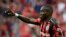 L'attaquant français de Leverkusen Moussa Diaby après un but marqué lors du match contre le Borussia Moenchengladbach à Leverkusen, en Allemagne, le 21 août 2021. 