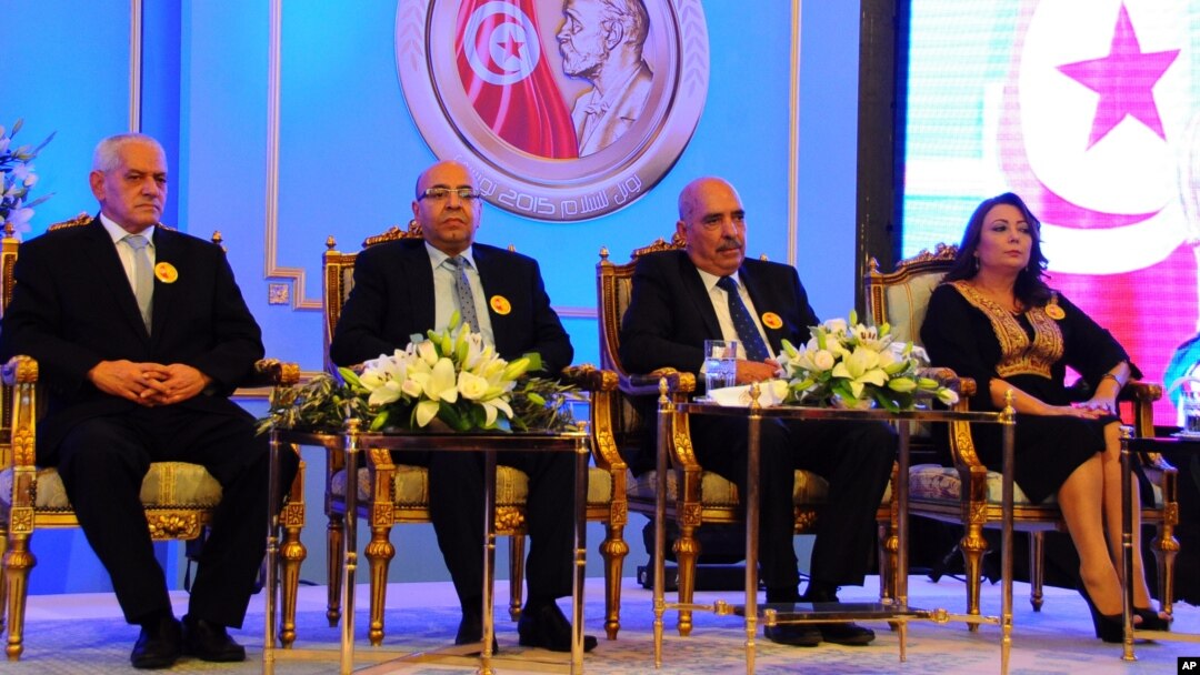 FILE - Left to right, Tunisian Nobel Peace Prize Winners Houcine Abassi, Abdessattar Ben Moussa, Fadhel Mafoudh and Wided Bouchamaoui are seen at a ceremony in Tunis, Nov.9, 2015.