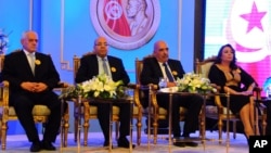 FILE - Left to right, Tunisian Nobel Peace Prize Winners Houcine Abassi, Abdessattar Ben Moussa, Fadhel Mafoudh and Wided Bouchamaoui are seen at a ceremony in Tunis, Nov.9, 2015.