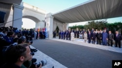 Official attendees of the G7 summit pose for a group photograph in Borgo Egnazia, near Bari in southern Italy, on June 14, 2024.