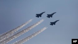 Indian Air Force Mirage fighters perform at the DefExpo in Lucknow, India, Feb. 5, 2020. 