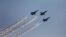 Indian Air Force Mirage fighters perform at the DefExpo in Lucknow, India, Feb. 5, 2020. 