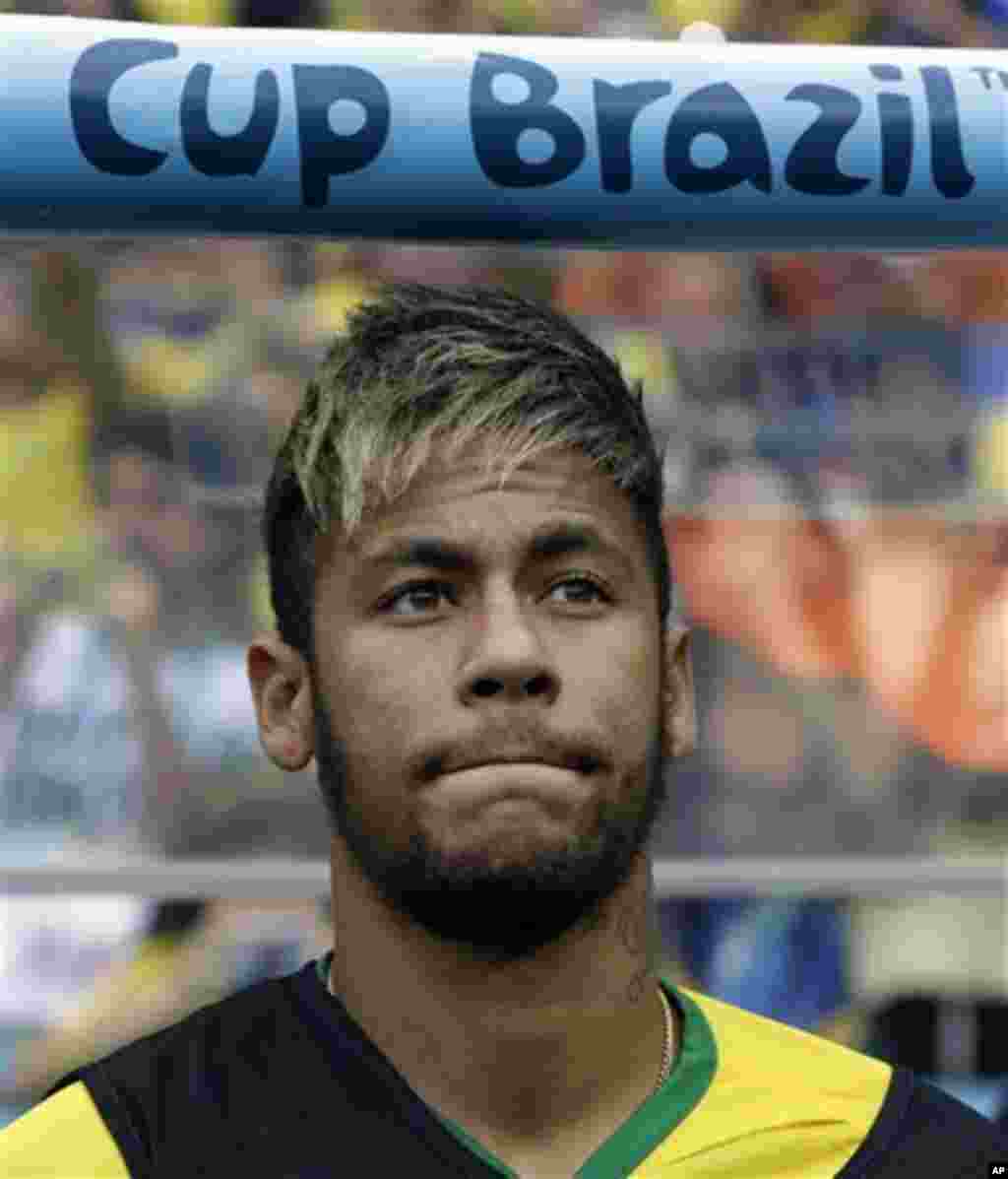 Brazil's Neymar waits for the start of the World Cup third-place soccer match between Brazil and the Netherlands at the Estadio Nacional in Brasilia, Brazil, Saturday, July 12, 2014. Neymar suffered a back injury during their quarterfinal match against Co