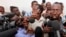 FILE - Somali journalist Abdiaziz Abdinur (R) talks to reporters after the high court freed him in the capital of Mogadishu, March 17, 2013.