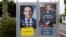 Official posters of the candidates for the 2017 French presidential election, Emmanuel Macron of the political movement En Marche! (Onwards!) and Marine Le Pen of the French National Front political party, are displayed in Saint-Josse, northern France, May 5, 2017.