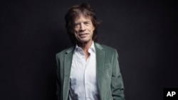 FILE - Mick Jagger of the Rolling Stones poses for a portrait in New York, Nov. 14, 2016. 