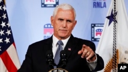 FILE - Vice President Mike Pence gestures while speaking in Washington, Aug. 24, 2018. 