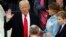 Donald Trump is sworn in as the 45th president of the United States by Chief Justice John Roberts as Trump's wife, Melania, and his son Barron look on the West front of the U.S. Capitol in Washington, Jan. 20, 2017. 