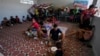 People displaced by violence in the Catatumbo region, where rebels of the National Liberation Army have been clashing with former members of the Revolutionary Armed Forces of Colombia, take shelter at a school in Tibu, Colombia, Jan. 20, 2025. 