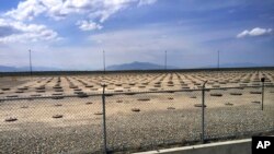 FILE - In this May 11, 2015, file photo, nuclear waste is stored in underground containers at the Idaho Nation. 
