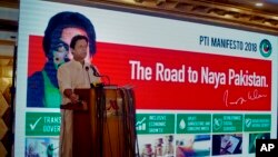 Pakistani opposition politician Imran Khan, leader of the Pakistan Tehreek-e-Insaf party, speaks during a press conference to present the party's manifesto for upcoming parliamentary elections, in Islamabad, Pakistan, July 9, 2018.