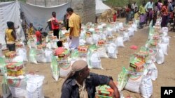 Men deliver aid donations from donors, in Aslam, Hajjah, Yemen, Sept. 23, 2018.