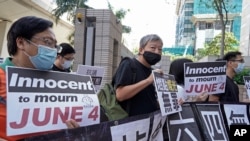 Various of groups of pro-democracy activists, including Lee Cheuk-Yan, center, arrive at a court in Hong Kong, Oct. 15, 2020.